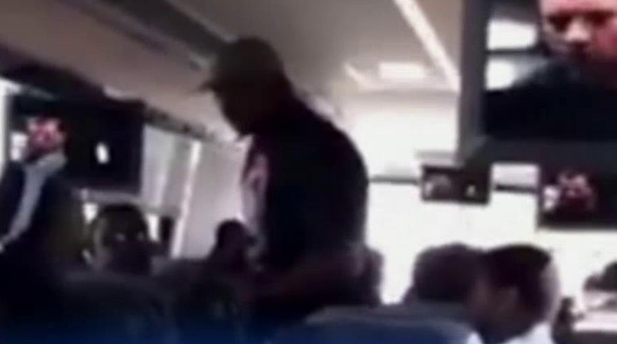 Caught on camera: High school coach pushes player