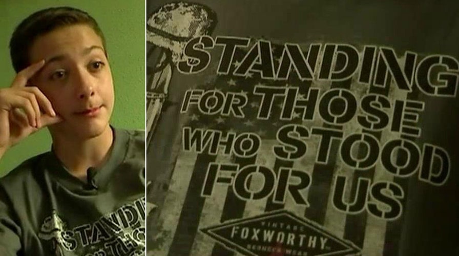 Boy suspended for wearing military T-shirt