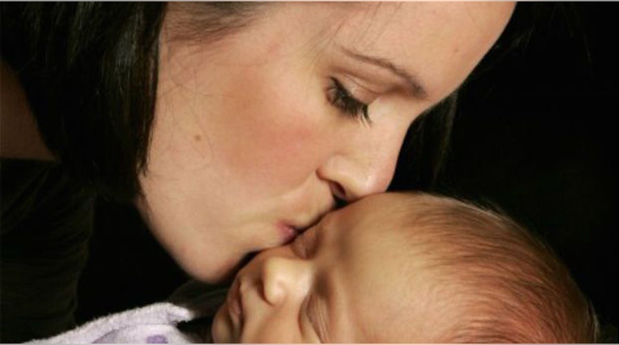 Nearly 50% of moms say being 'perfect parents' led to debt