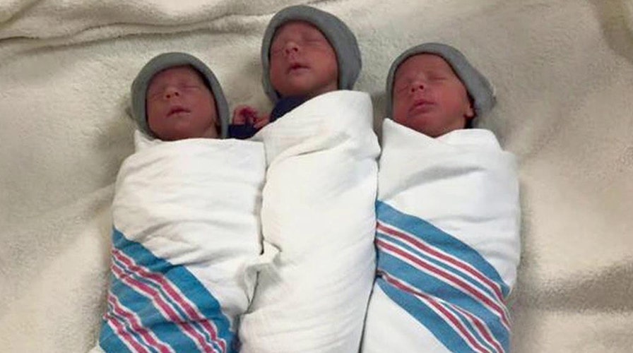 Extremely rare identical triplets born now home