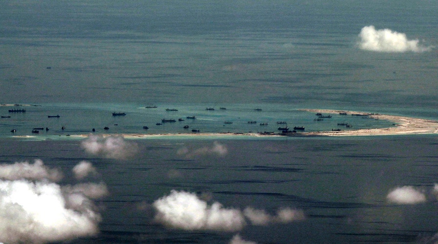 China warns US after Navy ship passes disputed islands