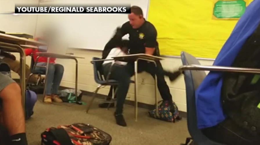 What was behind deputy's manhandling of female student?
