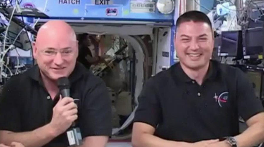 Astronauts perform historic spacewalk outside ISS