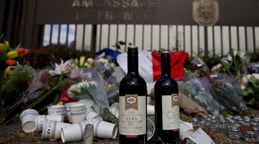 Memorial for attack victims grows outside French embassy