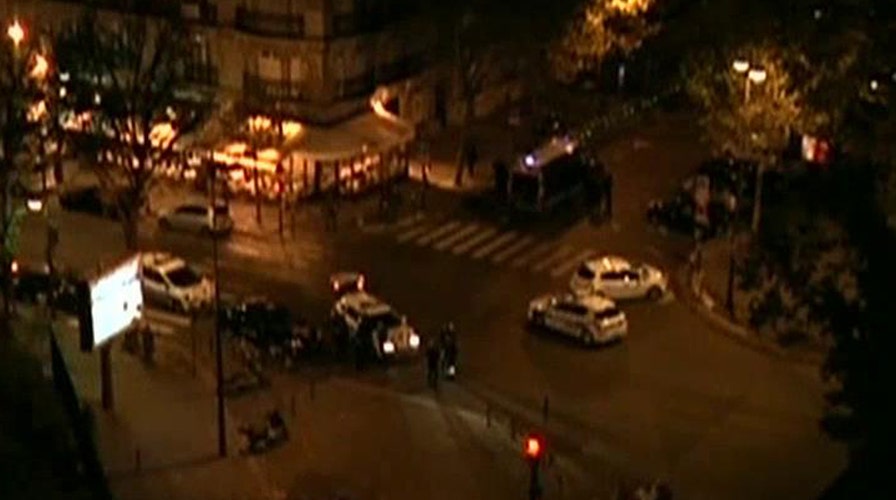 Heavily armed police gather outside Paris hotel