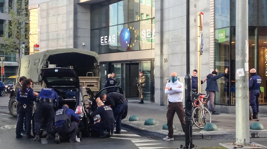 Raids spread across Europe in hunt for Paris attack suspects