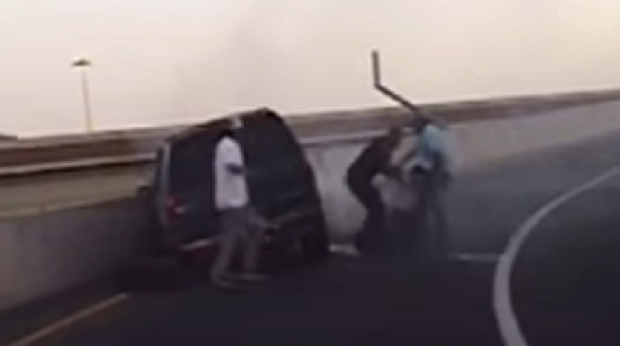 'Dude, you're on fire!' Cop saves man from burning SUV