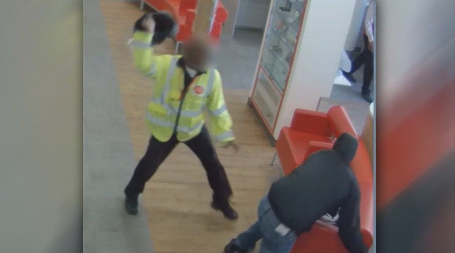 Watch security guard attack robber with helmet