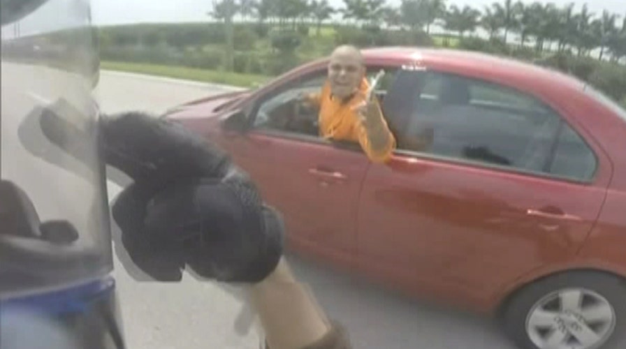 Insane road rage altercation caught on helmet cam