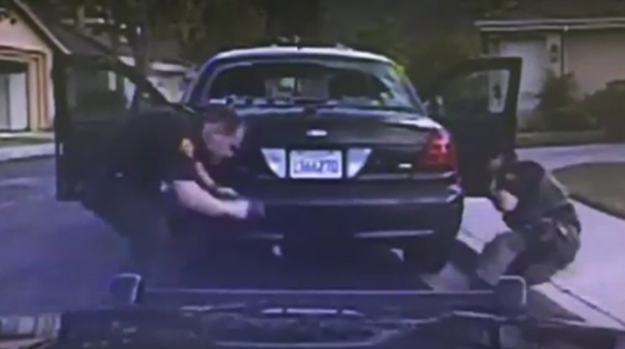 Suspect sprays bullets at cops with automatic rifle