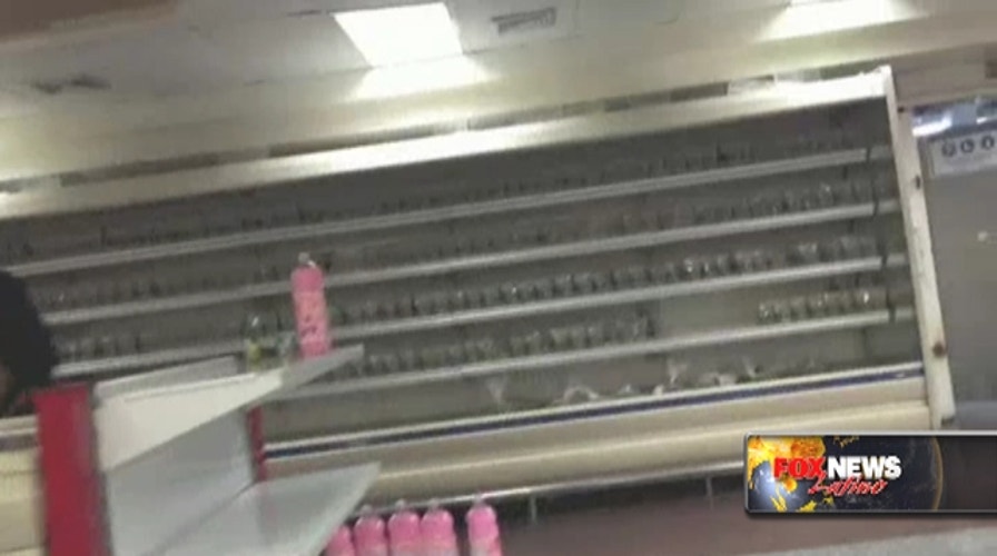 Hungry Venezuelans find empty supermarket shelves