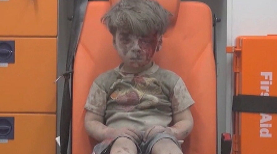 Child's face shows horror of ceaseless war in Syria
