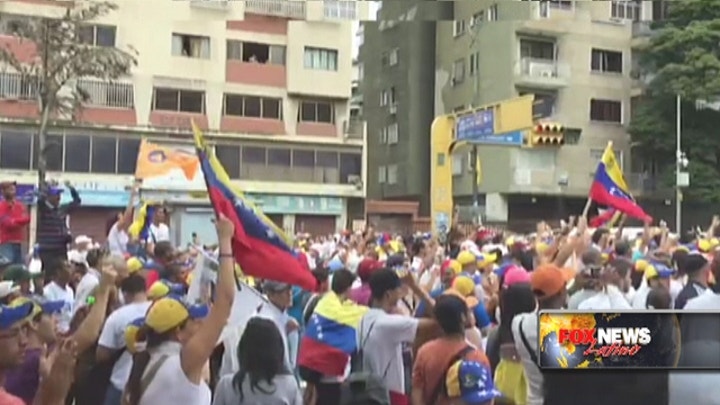 Venezuelans flood streets demanding Maduro's recall