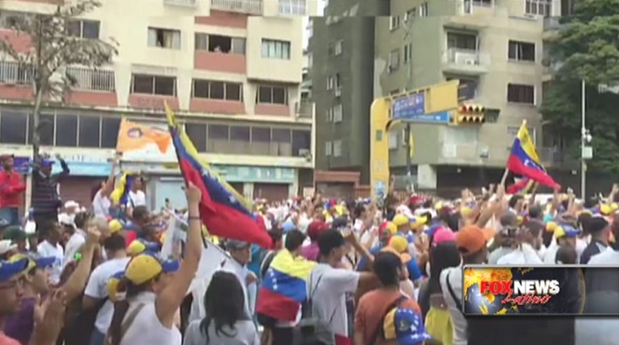 Venezuelans flood streets demanding Maduro's recall