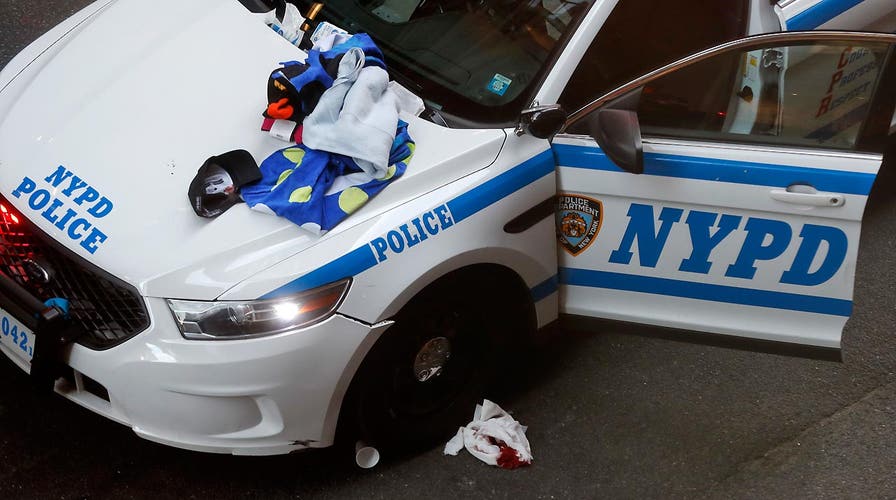 Man wielding meat cleaver injures three NYPD officers 