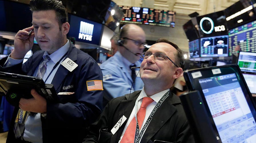 Stocks close a milestone week with more green