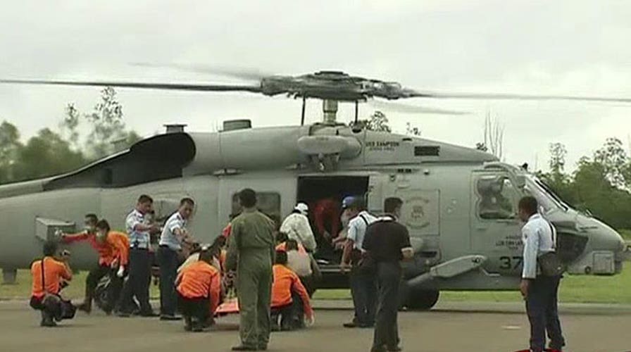 Recovered bodies offer clues in AirAsia flight investigation