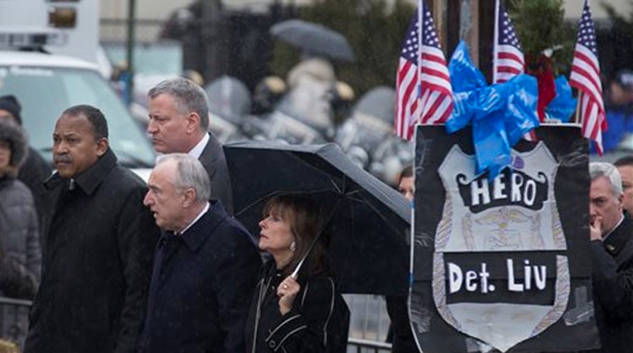 Family, dignitaries gather for the wake of NYPD Officer Liu