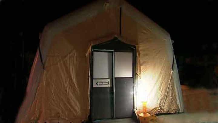 Hospital sets up tent to triage flu victims
