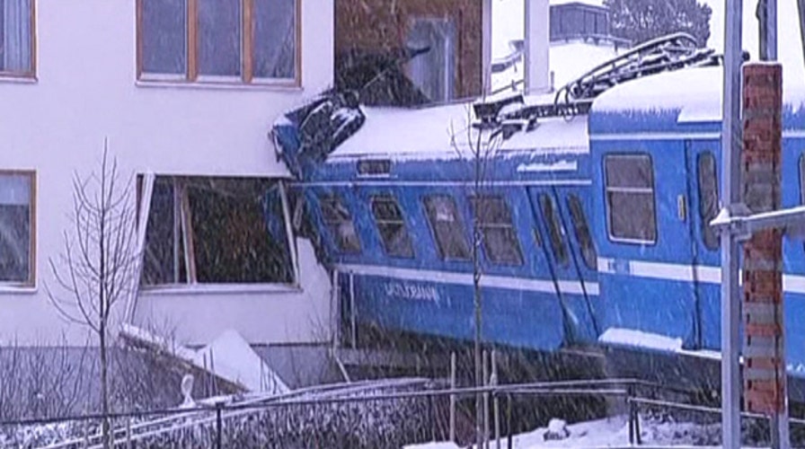 Stolen commuter train crashes into apartment building