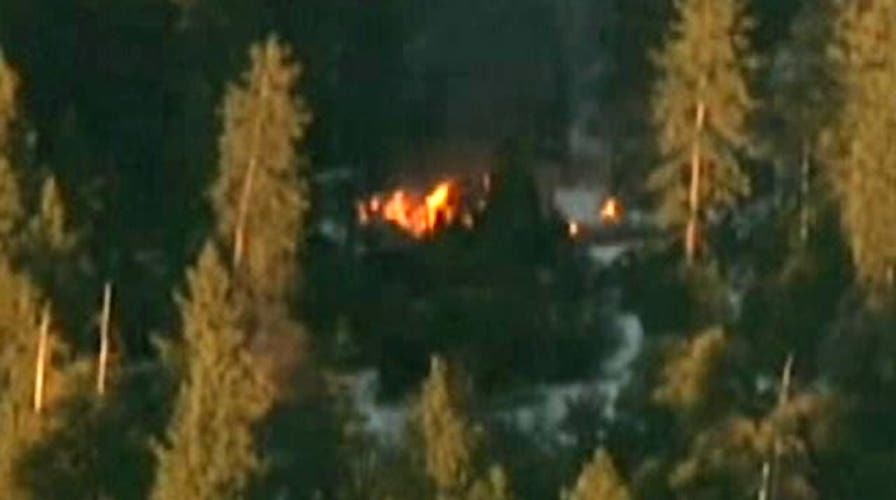 Report: Single shot heard before fire engulfed cabin