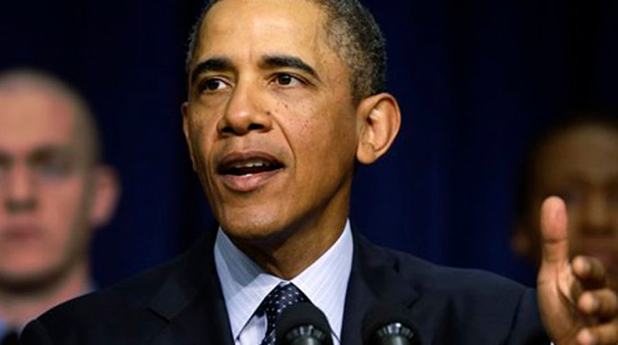 Obama warns of doom and gloom as spending cuts near