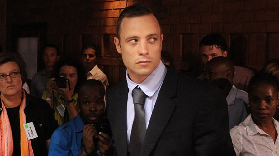 Oscar Pistorius reports to police as part of bail agreement