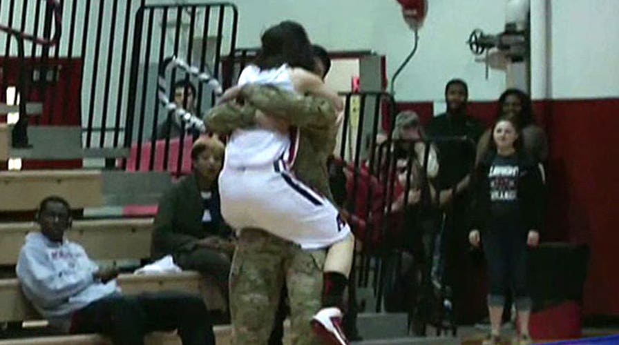 Basketball star surprised on court by military brother