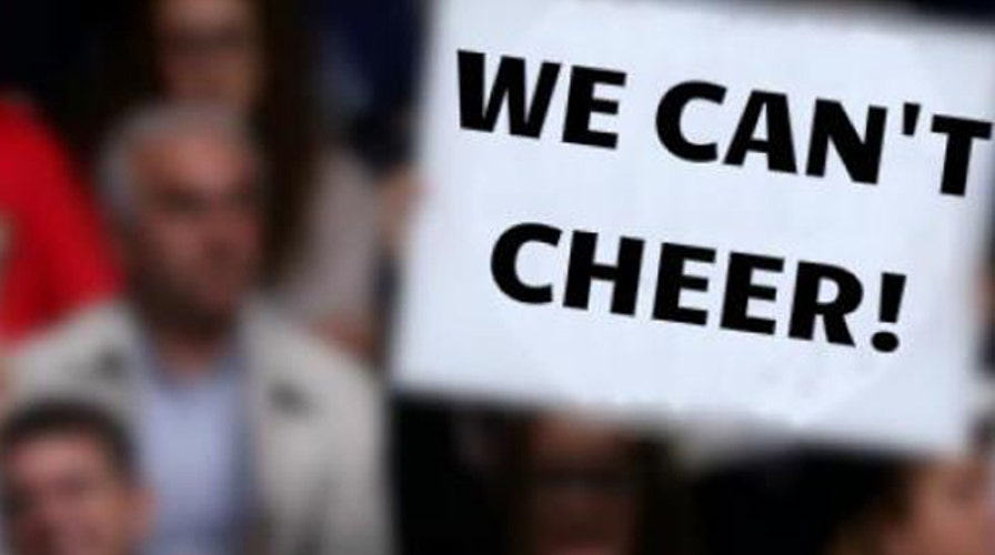 Parents sent to penalty box for cheering at kids' game