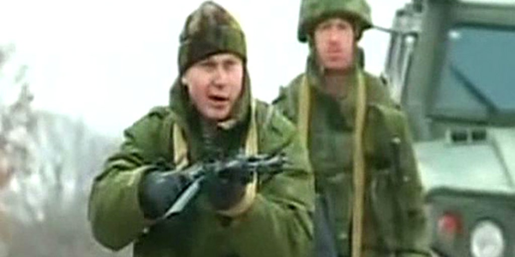 Ukrainian soldiers confront Russian forces at airbase | Fox News Video