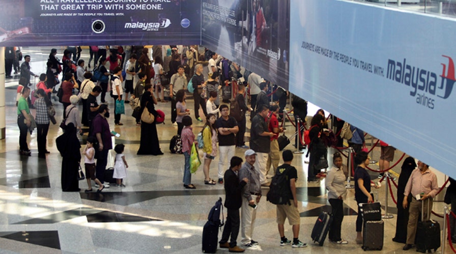 Focus on stolen passports in Malaysia Airlines mystery