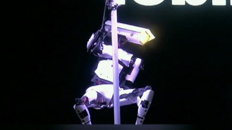 Robots pole dance at German computer expo