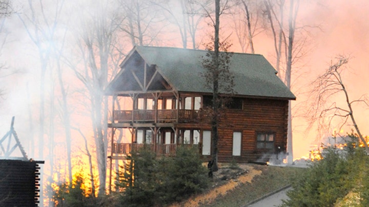 Wildfire destroys dozens of homes in popular resort town