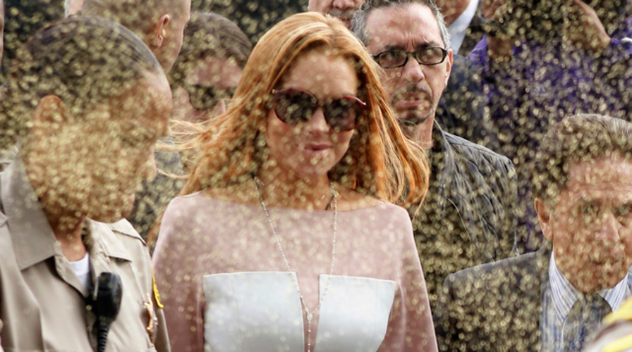 'Glitter-bomb' greeting for Lindsay Lohan at court arrival