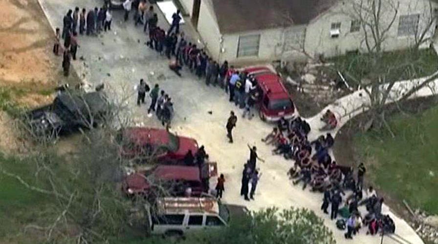 Police rescue more than 100 immigrants in stash house