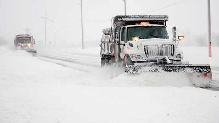 Snowfall records smashed as monster Midwest storm heads east