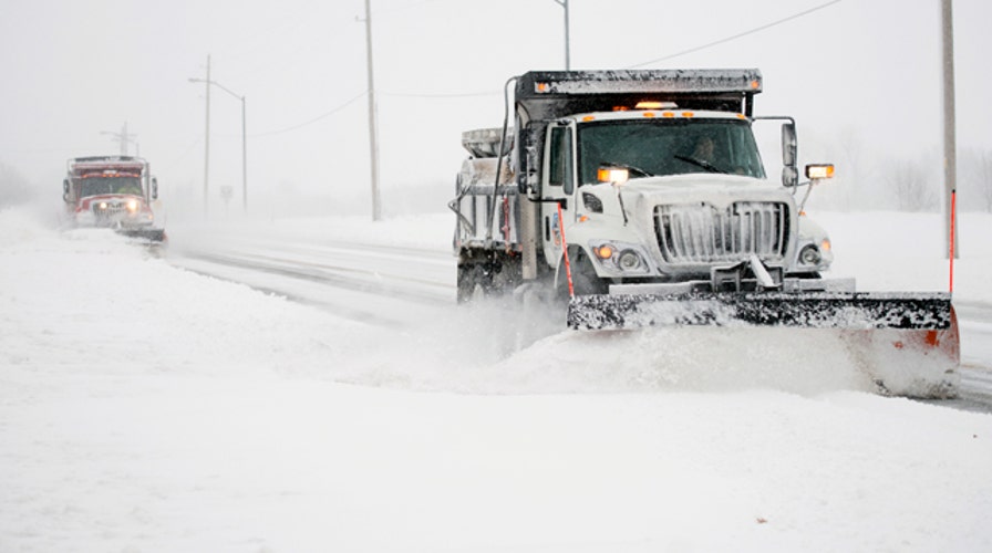 Snowfall records smashed as monster Midwest storm heads east
