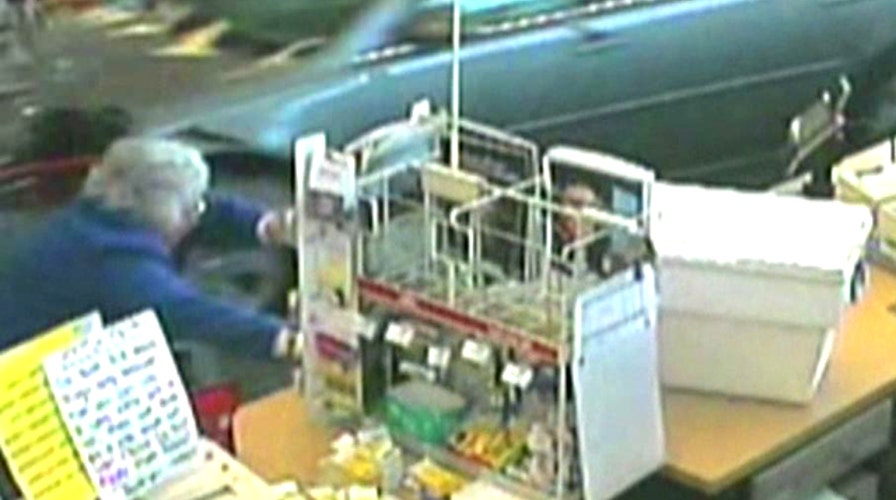 Out-of-control car crashes into CVS, grazes customer