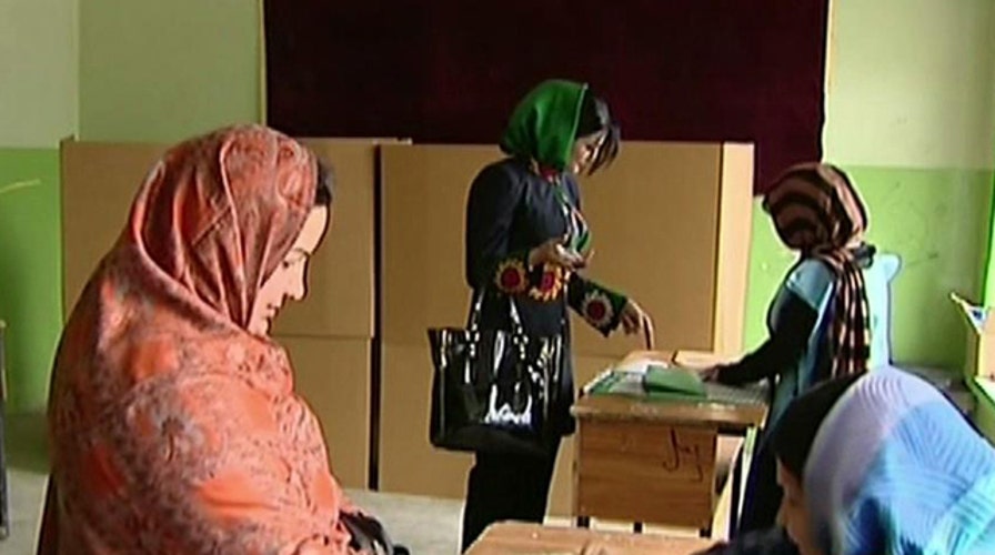 Afghans defy Taliban threats to vote in presidential election