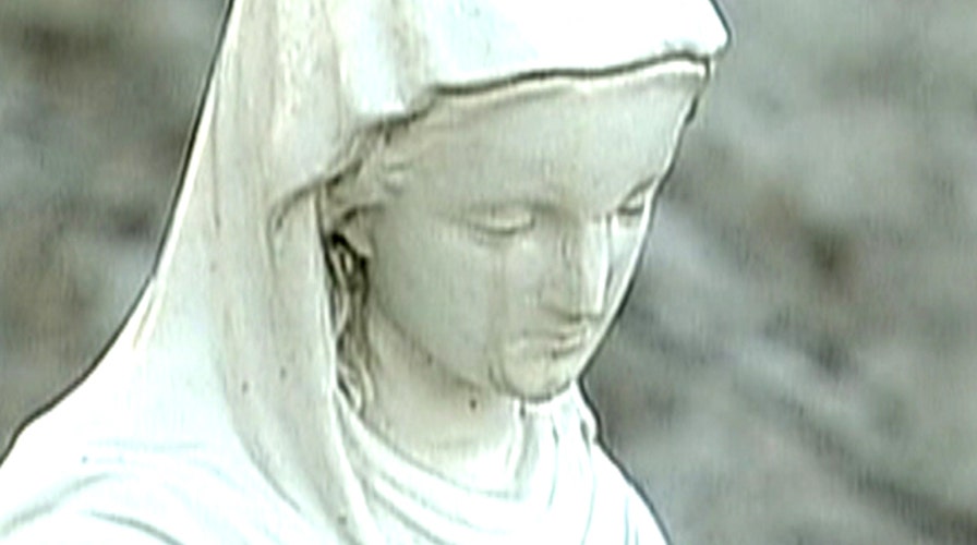 Believers flock to see 'crying' Virgin Mary statue