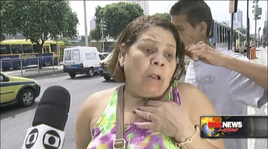 Robber Tries To Steal From Woman During TV Interview