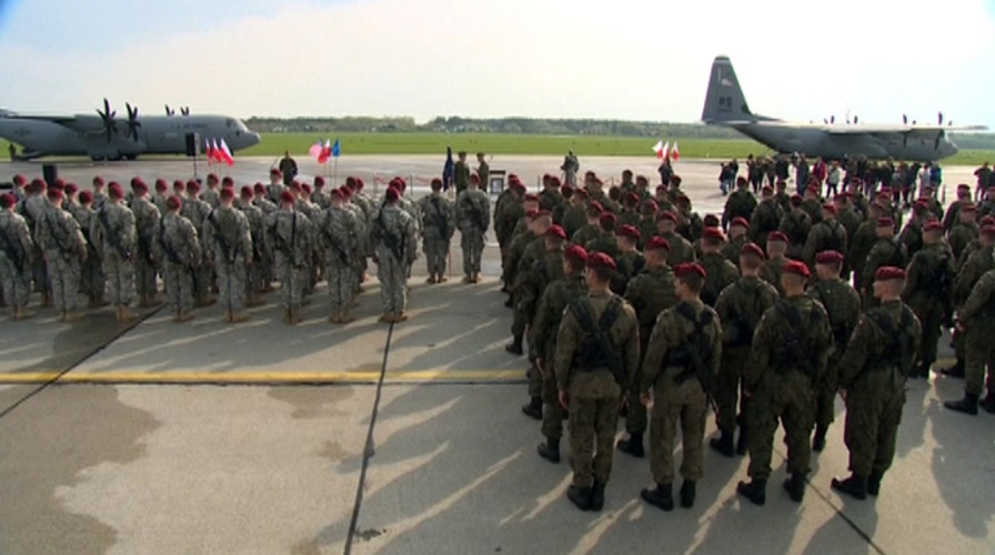 US sends message to Putin as troops arrive in Poland