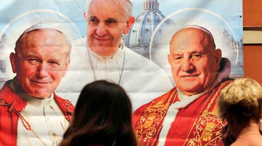 What makes Popes John XXIII and John Paul II saints?