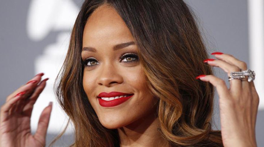 Rihanna takes top off on Twitter