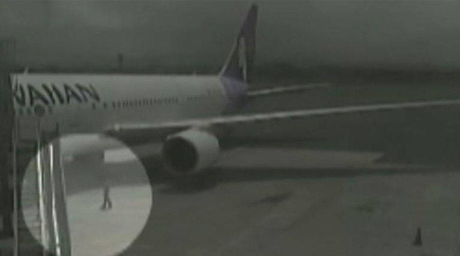 Security footage shows teen stowaway in plane's wheel well