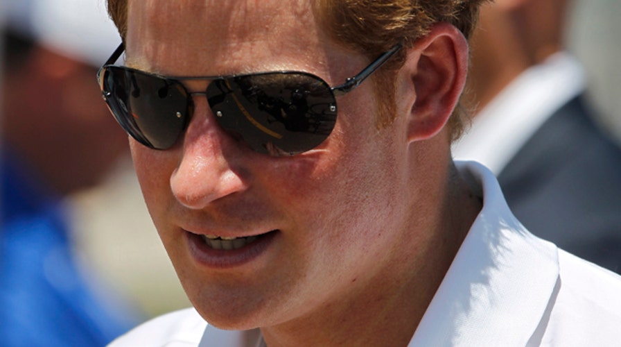 Prince Harry visits towns hit hard by Superstorm Sandy