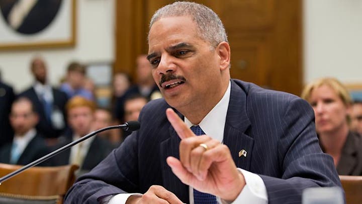 Holder's changing tune on involvement in journalist scrutiny