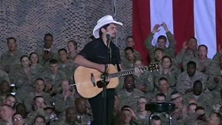 President Obama and singer Brad Paisley surprise the troops