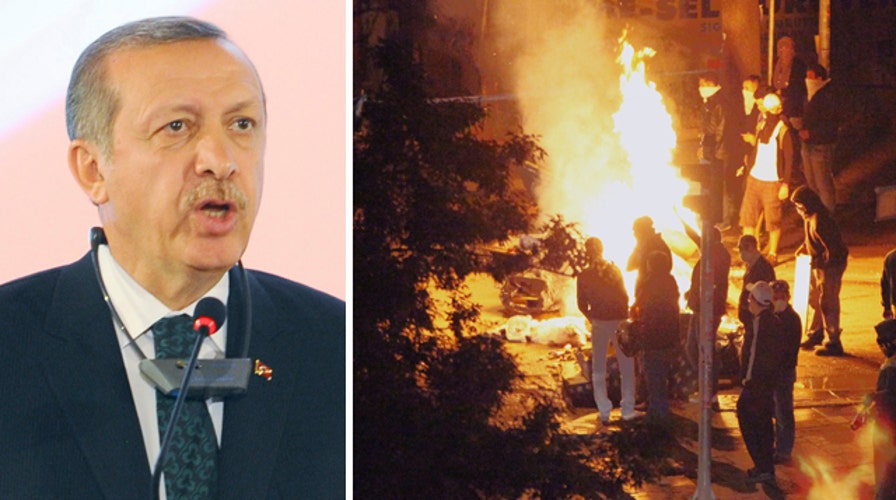 Turkish prime minister defiant in face of deadly mass riots