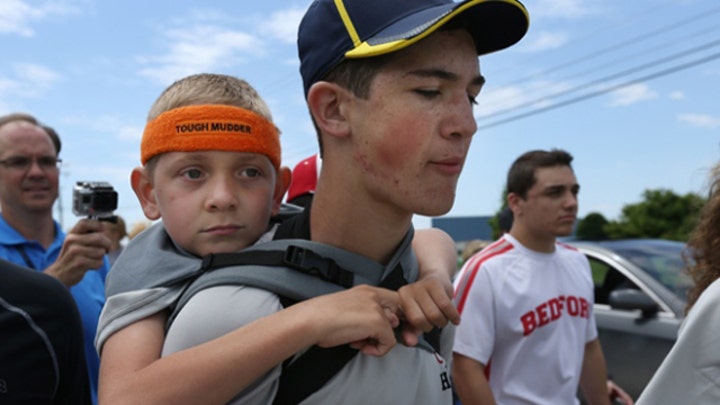 Teen carries brother 40 miles for cerebral palsy awareness 